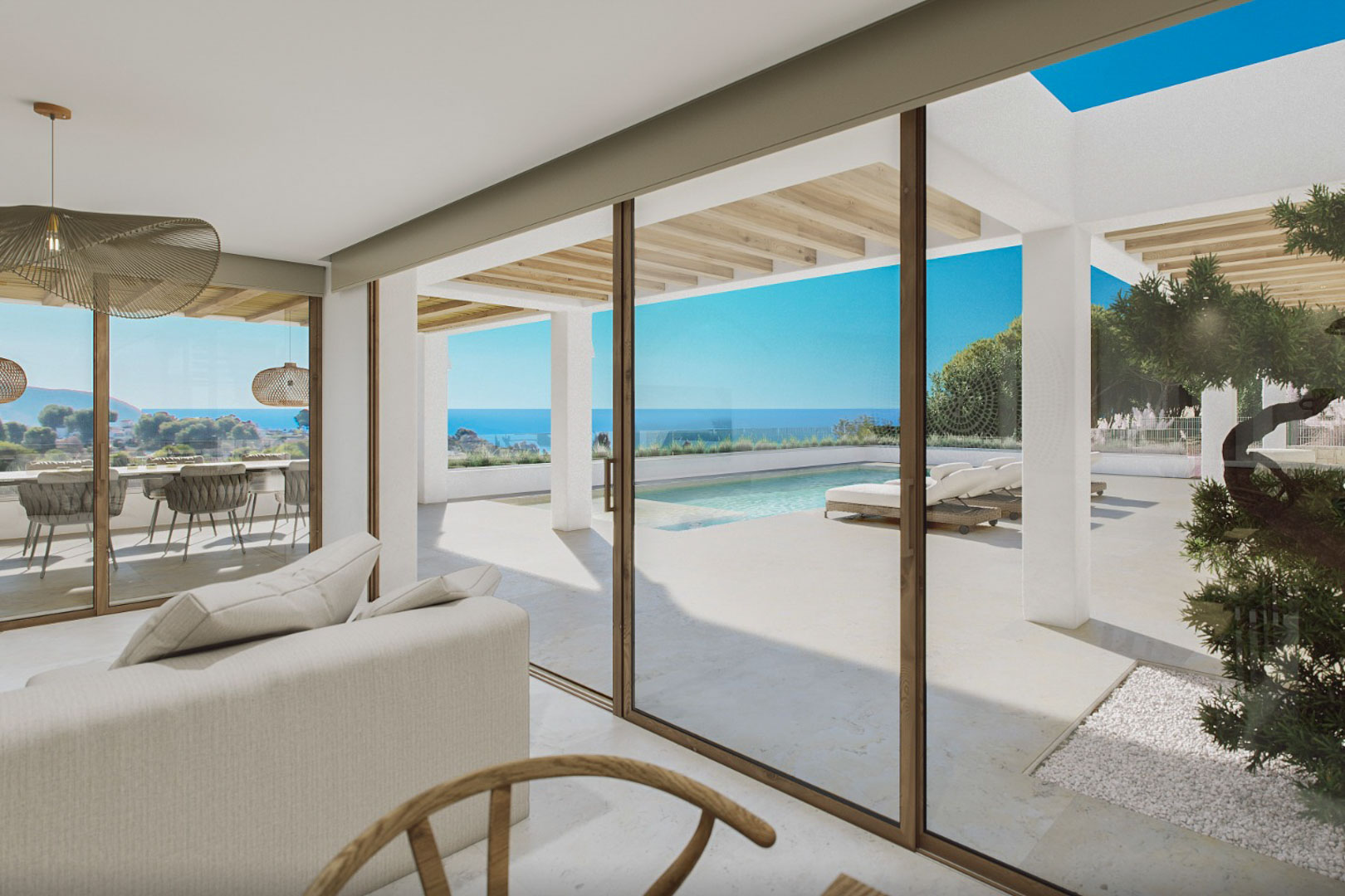 Modern living room with pool and sea views, direct access to the outdoor terrace.