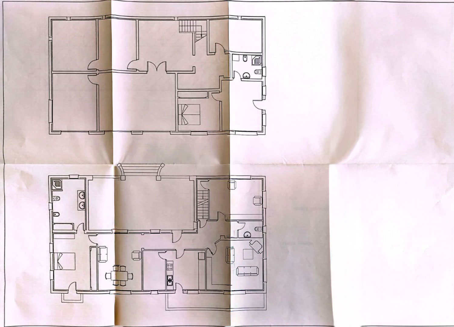 Detailed architectural floor plan showing the two-level layout of the residence, including room distributions, staircases, and outdoor terrace areas.