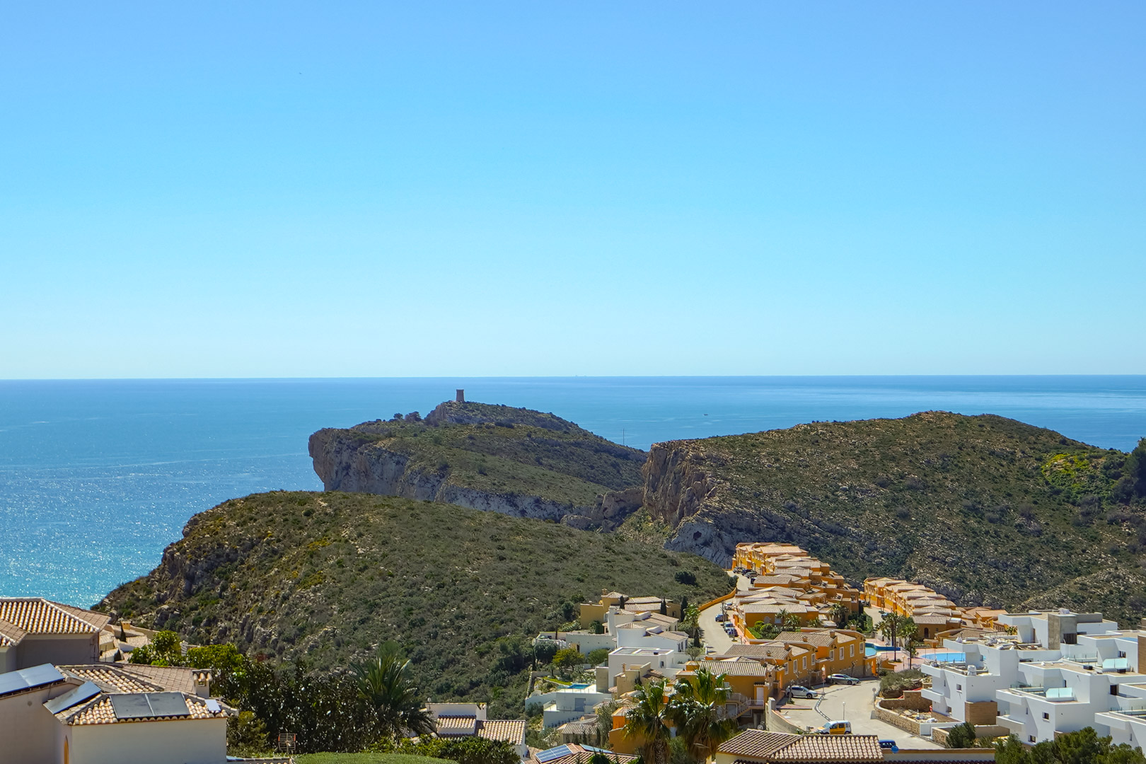 Panoramic views from the property overlooking Cap d’Or in Moraira, featuring the Mediterranean Sea and the residential landscape of Cumbre del Sol.