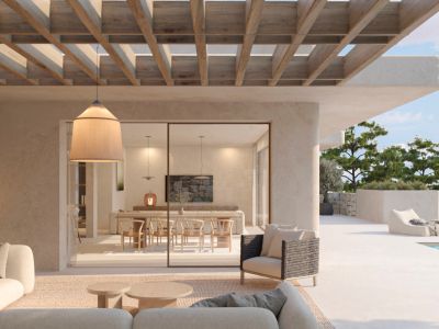 Expansive outdoor terrace with a wooden pergola and lounge area, seamlessly connecting to the indoor dining room via large glass sliding doors. A private pool is visible beyond.