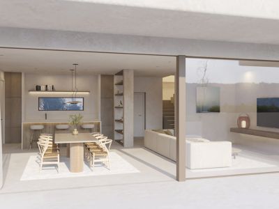 Spacious open-plan living and dining area with a wooden table and breakfast bar, seamlessly connecting to the terrace via large sliding glass doors.