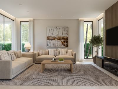 Spacious living room featuring two beige sofas, a wooden coffee table, and a textured rug. Large windows offer views of lush greenery, complemented by a wood-paneled TV wall with a modern fireplace.