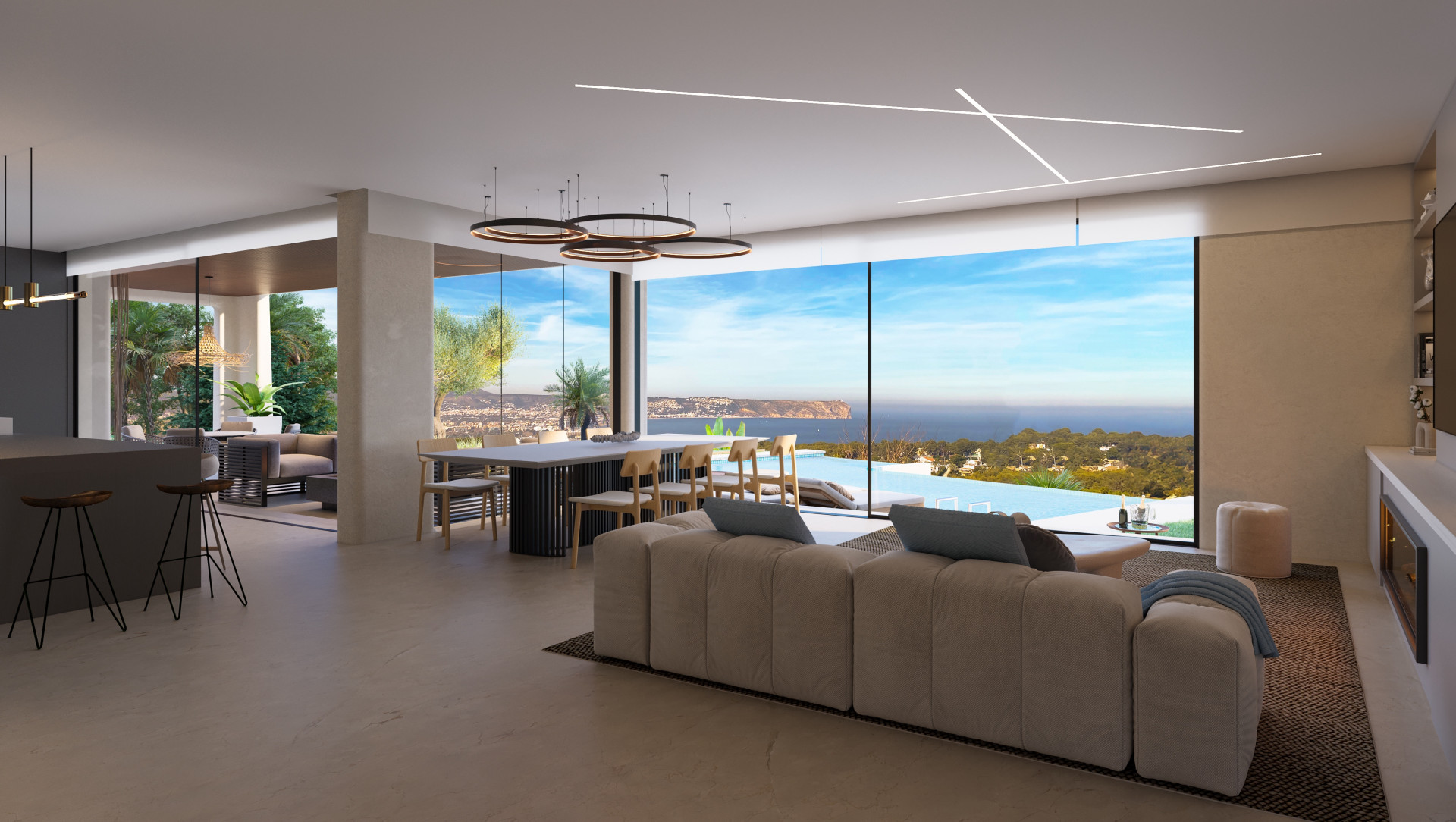 Spacious living room with panoramic sea views, open kitchen, and modern furnishings in Jávea.