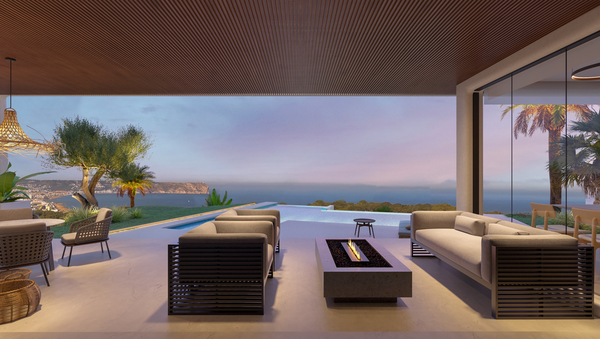 Terrace with sea views and infinity pool, modern outdoor furniture and low fireplace.