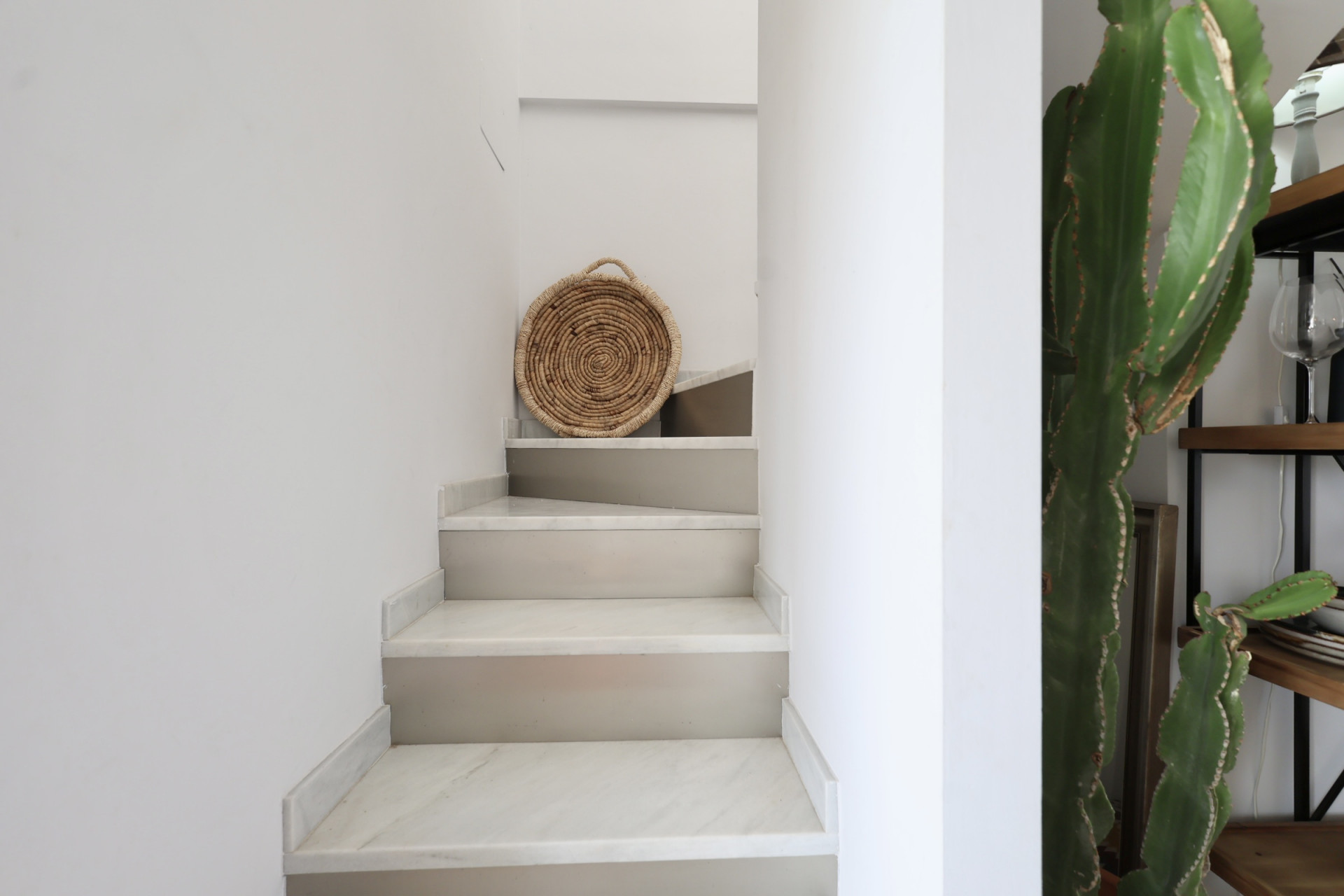 Stairway detail with marble steps and rustic decor in Jávea.