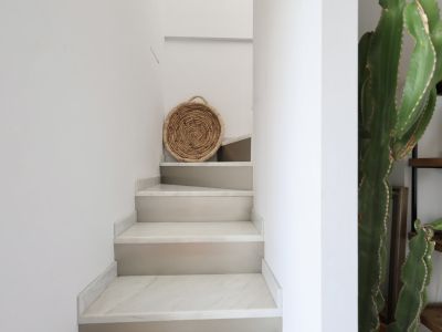 Stairway detail with marble steps and rustic decor in Jávea.