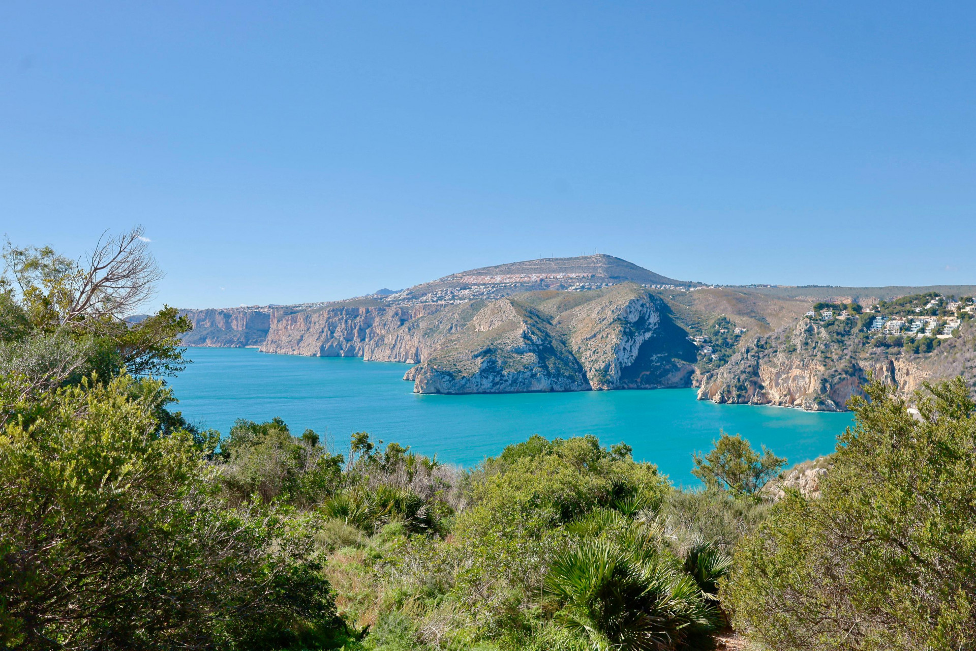Panoramic views of the rocky coastline and Mediterranean Sea from the lush greenery of Jávea.