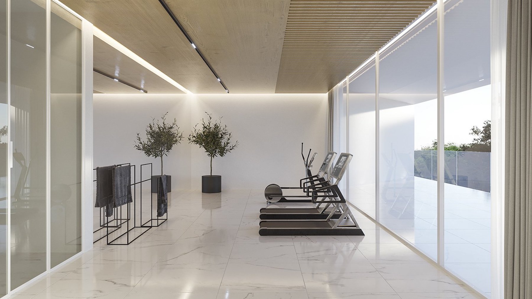 Private home gym featuring white marble flooring, wooden ceiling panels with integrated lighting, and floor-to-ceiling glass walls.