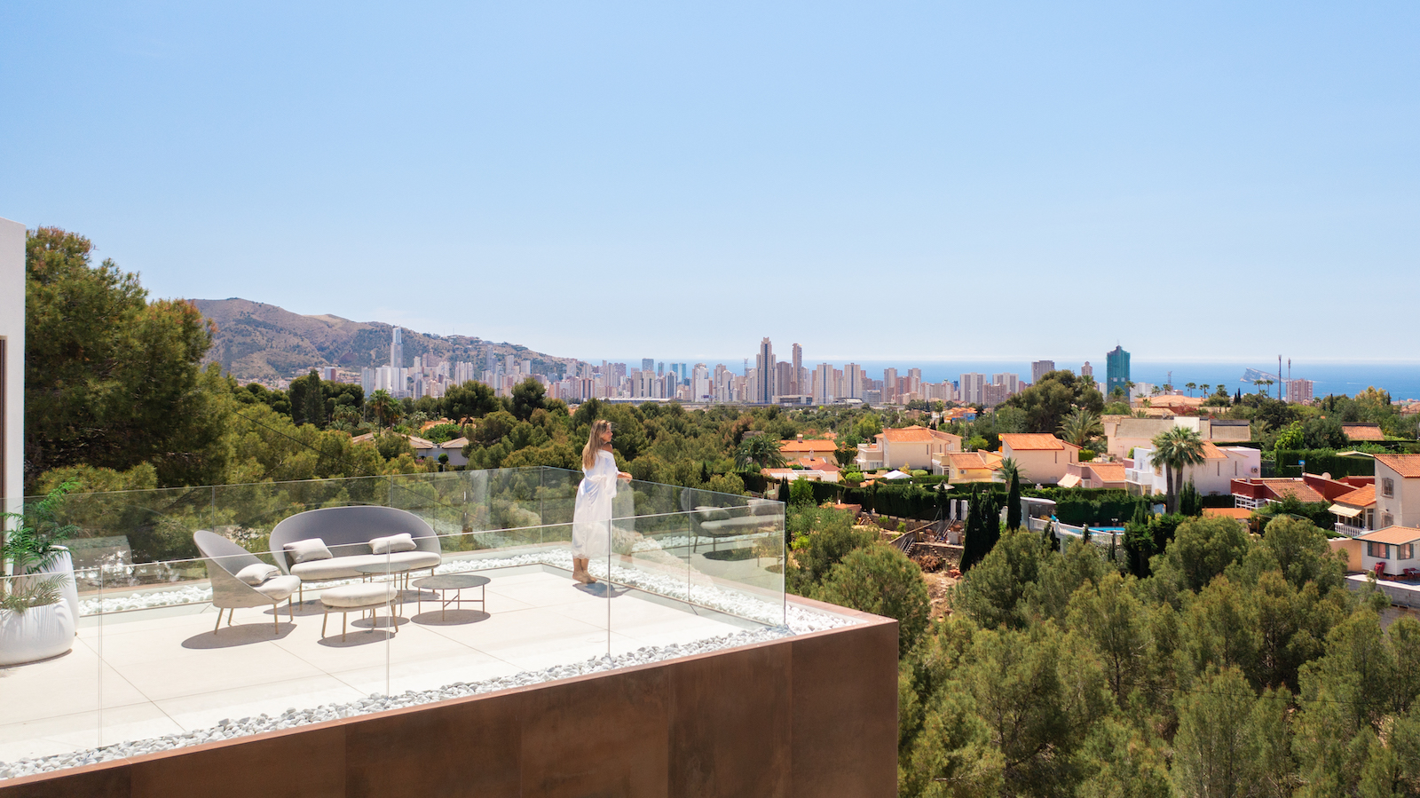 Terrace with panoramic city views and modern outdoor furniture set.