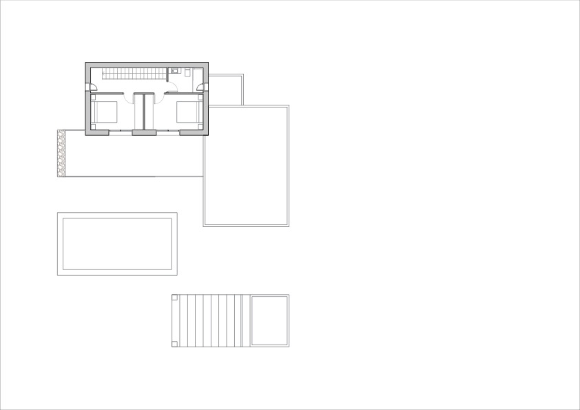 Detailed architectural floor plan of the upper level, highlighting the layout of two bedrooms, a bathroom, and the central staircase.