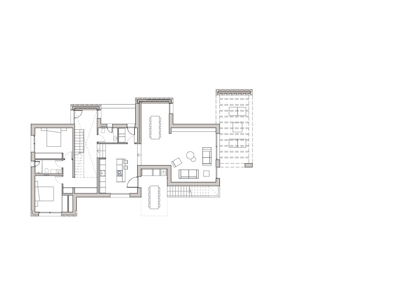 Architectural floor plan of the main level illustrating the open-plan living area, kitchen with island, en-suite bedrooms, and extensive outdoor terrace spaces.