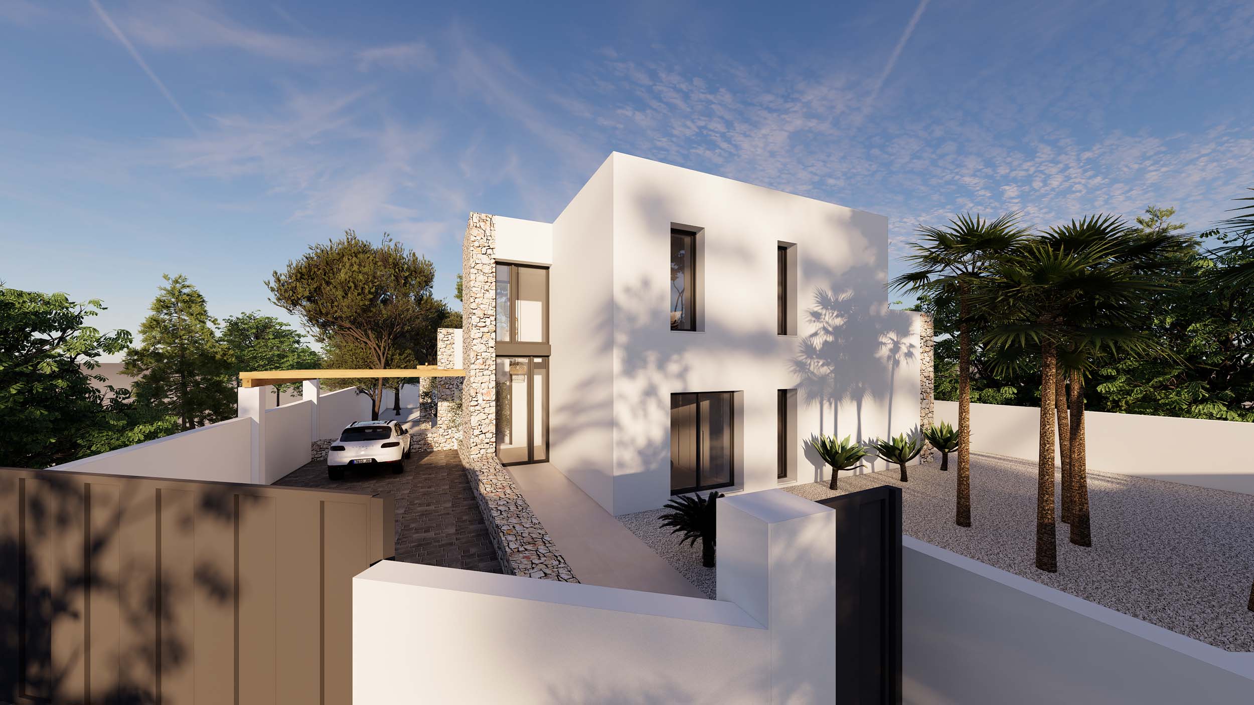 Ibiza-style exterior featuring natural stone accents, white cubic architecture, and a gravel garden with palms. A paved driveway leads to a pergola-covered parking area.