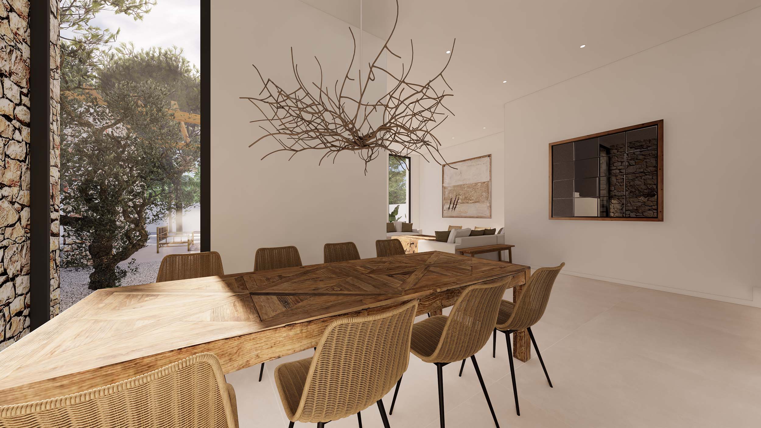 Ibizan-style dining area featuring a rustic wooden table and wicker chairs. Highlights include a branch-inspired chandelier and floor-to-ceiling windows facing the Mediterranean garden.