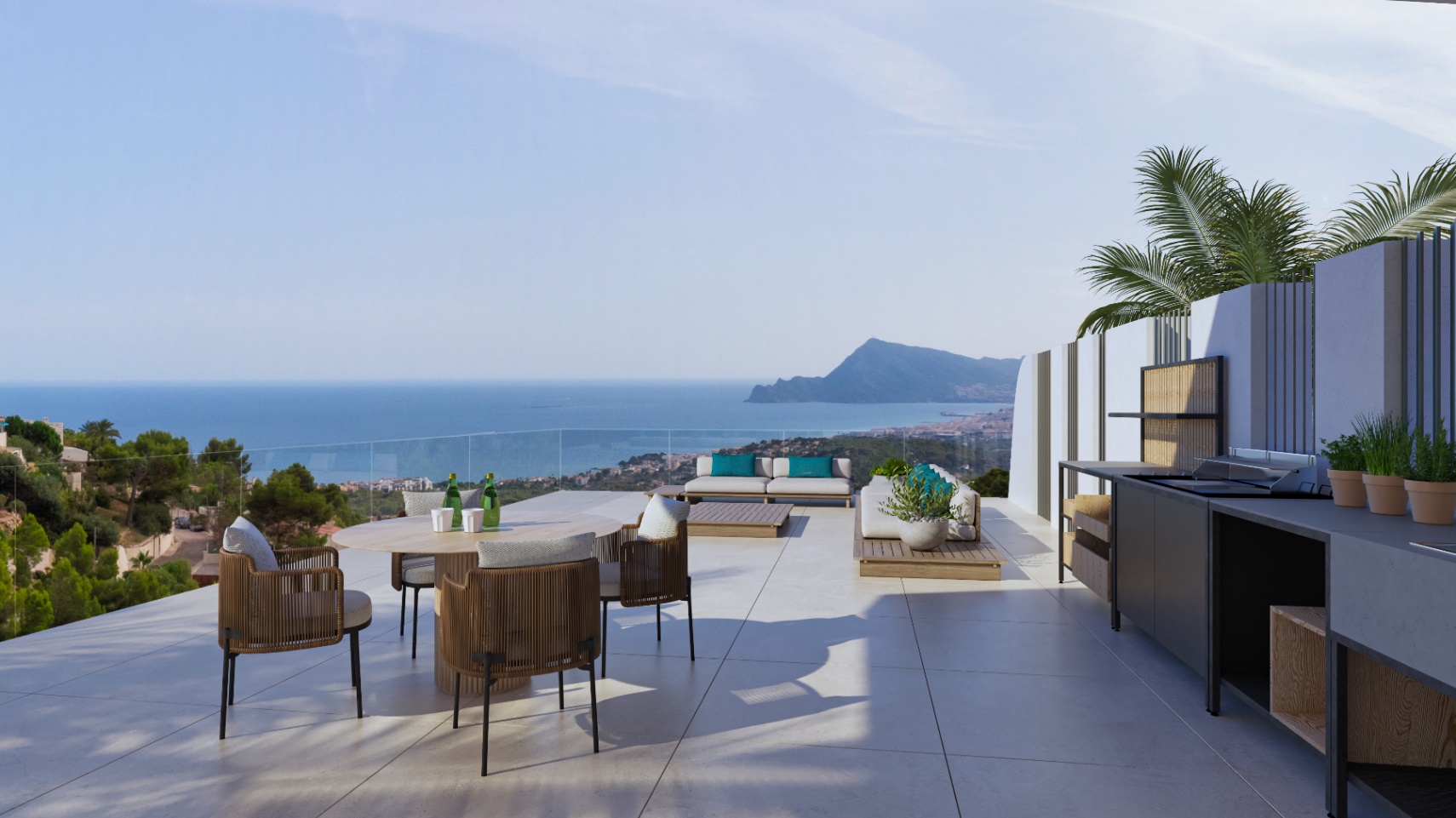 Outdoor terrace featuring a summer kitchen, dining area, and lounge seating. It offers panoramic Mediterranean Sea and coastline views through a seamless glass balustrade.