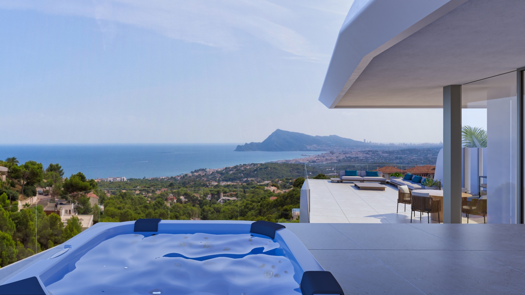Upper terrace featuring a built-in hot tub, porcelain tiling, and expansive views of the Mediterranean Sea and Sierra Helada mountain range.