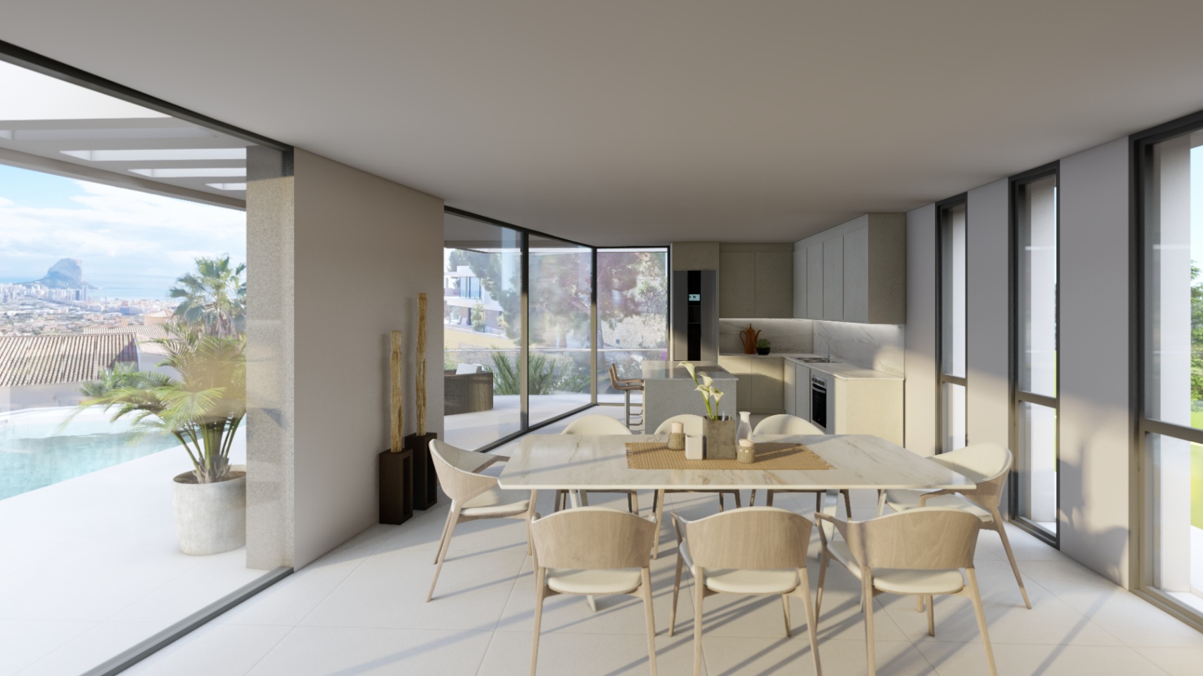Open-concept dining area and minimalist kitchen featuring floor-to-ceiling glass walls that reveal the infinity pool and views of the Peñón de Ifach.