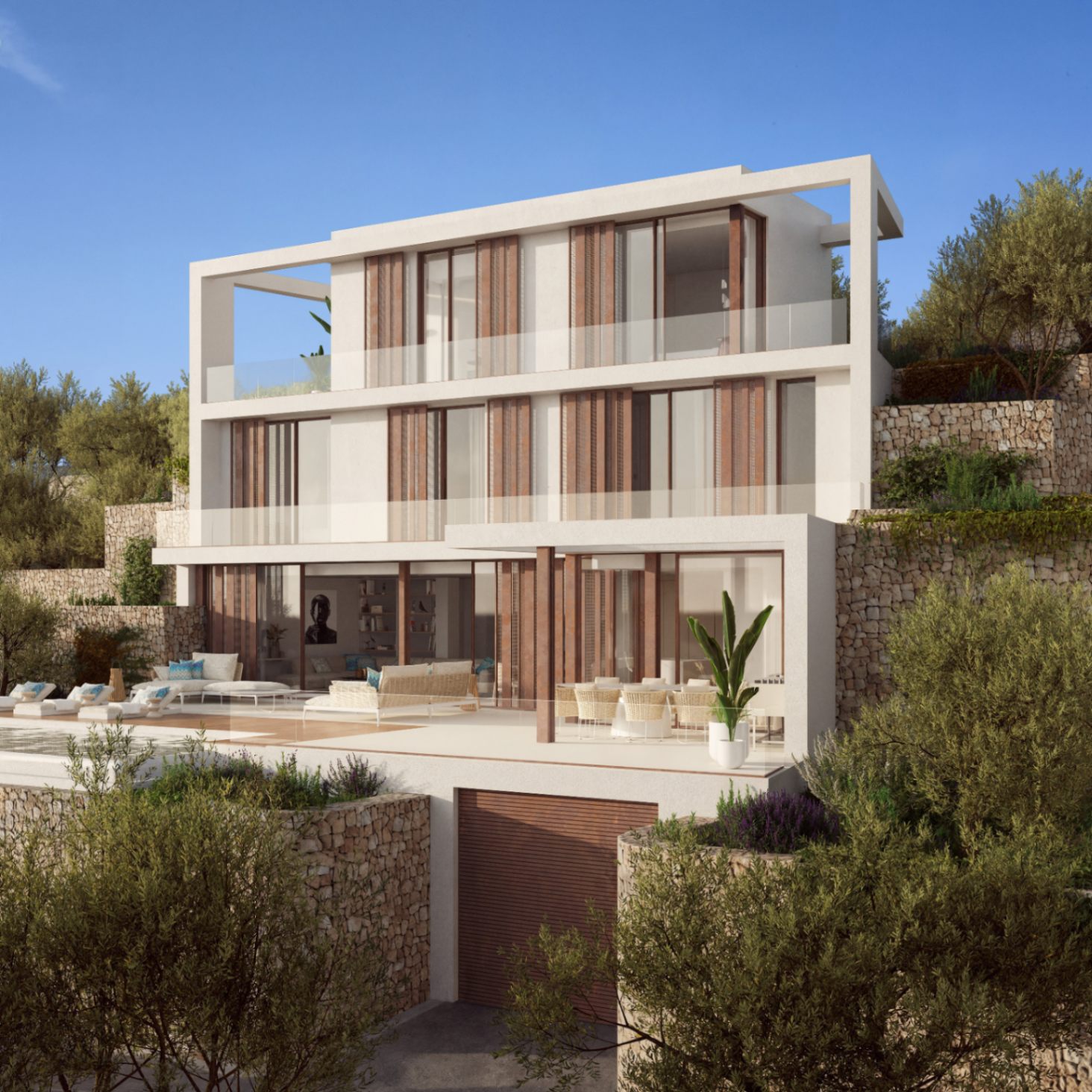 Three-level facade featuring dry stone walls, wooden shutters, and expansive glass. The main terrace integrates a pool and lounge areas within a tiered Mediterranean landscape.