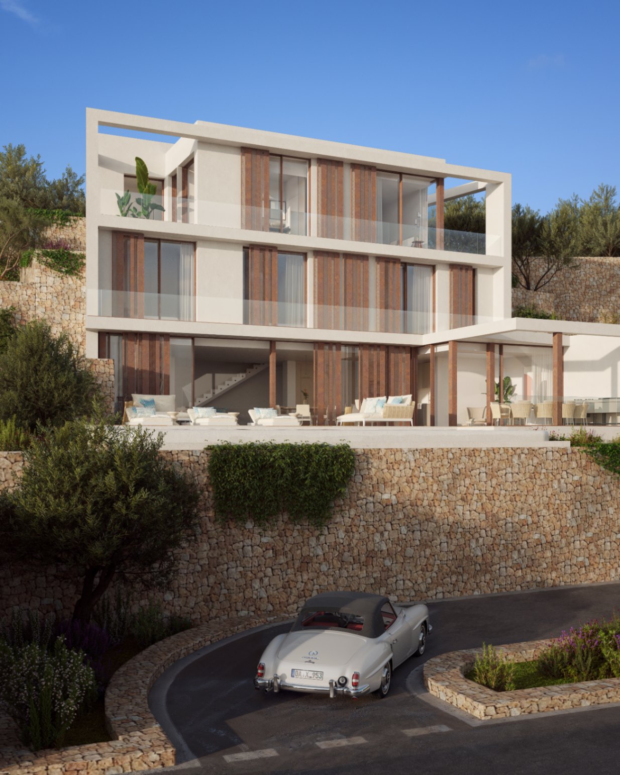 Three-level facade featuring natural stone retaining walls, wooden shutters, and expansive glass balconies. The exterior includes a lounge terrace and integrated Mediterranean landscaping.