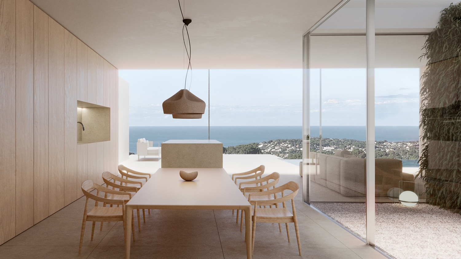 Minimalist dining area featuring a light wood table, panoramic sea views, and modern pendant lighting.