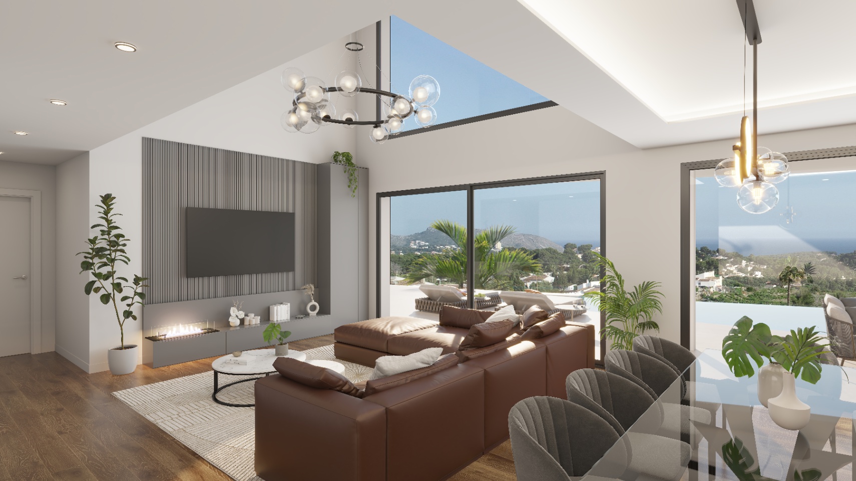Open-concept living area featuring double-height ceilings, a modern integrated fireplace, and large sliding doors opening to the terrace with sea views.