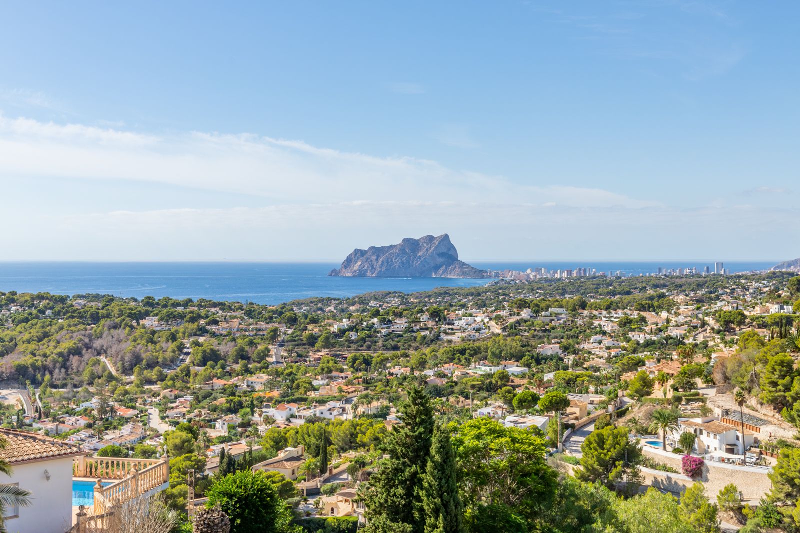 Panoramic views from the property overlooking the Peñón de Ifach and the Mediterranean Sea, framed by the lush pine forests of Benimeit.