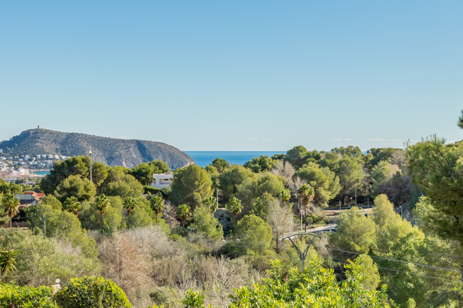 Panoramic views from the property overlooking the Mediterranean Sea and Cap d'Or, bordered by a lush protected green zone ensuring absolute privacy.