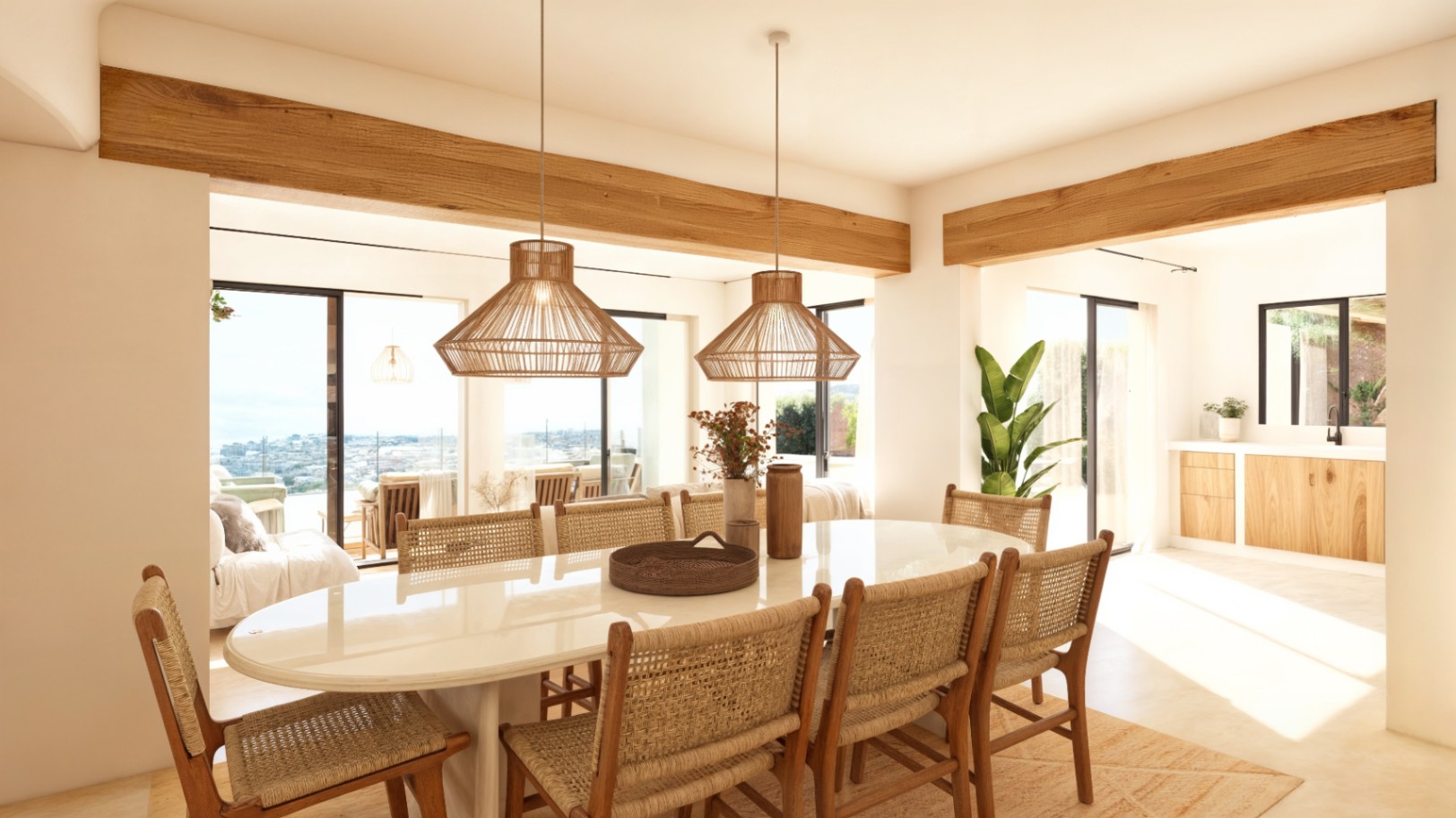 Ibicencan-style dining area featuring an oval table, rattan chairs, and exposed wooden beams, with large glass doors opening to Mediterranean views.