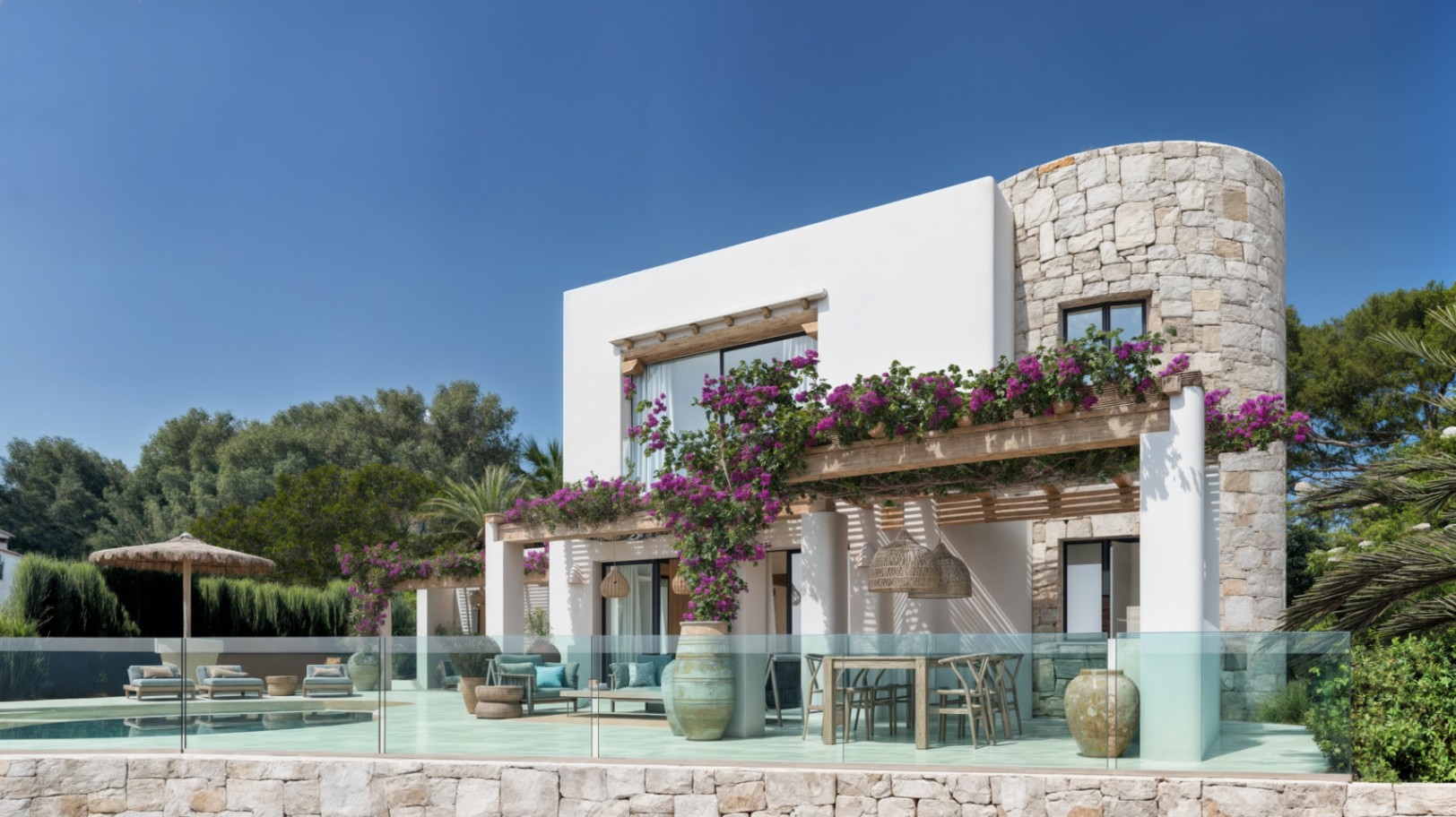 Ibicencan villa exterior showcasing natural stone accents, a wooden pergola with bougainvillea, and a spacious terrace with outdoor dining and lounge areas.