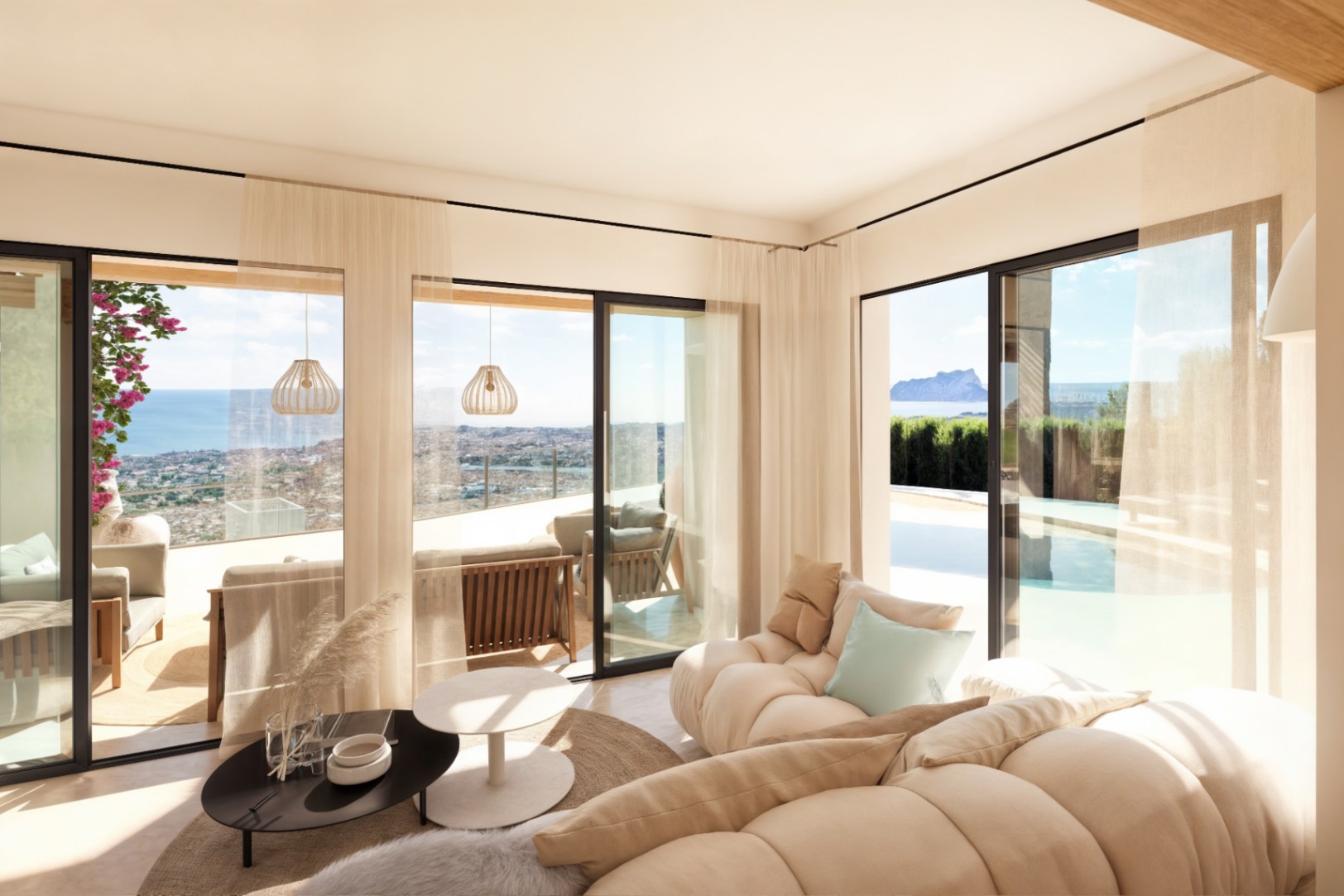Open-plan living room featuring large Technal sliding doors that reveal panoramic sea views and the Peñón de Ifach, seamlessly connecting the interior to the terrace.