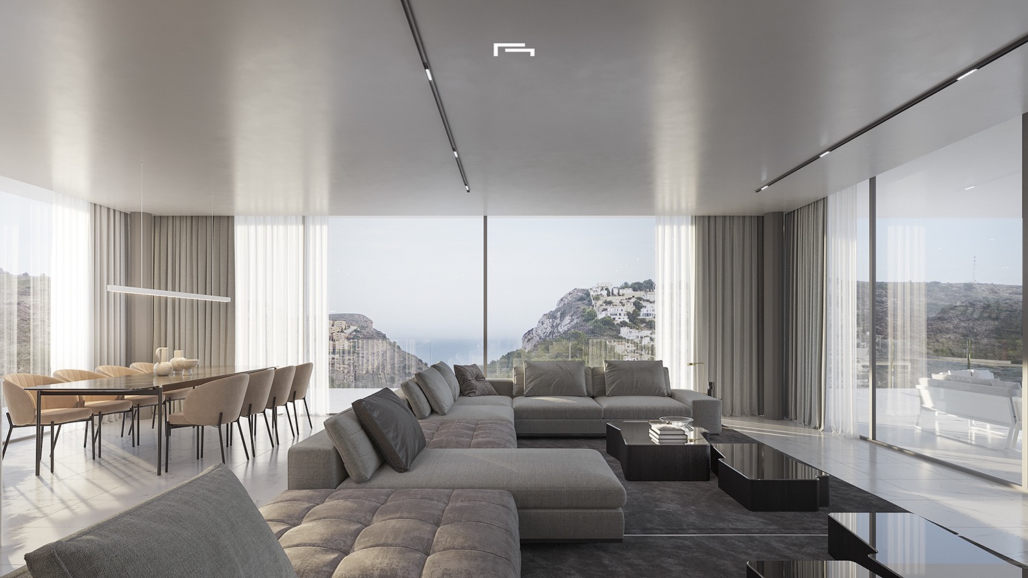 Open-plan living and dining area featuring floor-to-ceiling glass walls with sea views, a large modular sofa, and minimalist recessed track lighting.