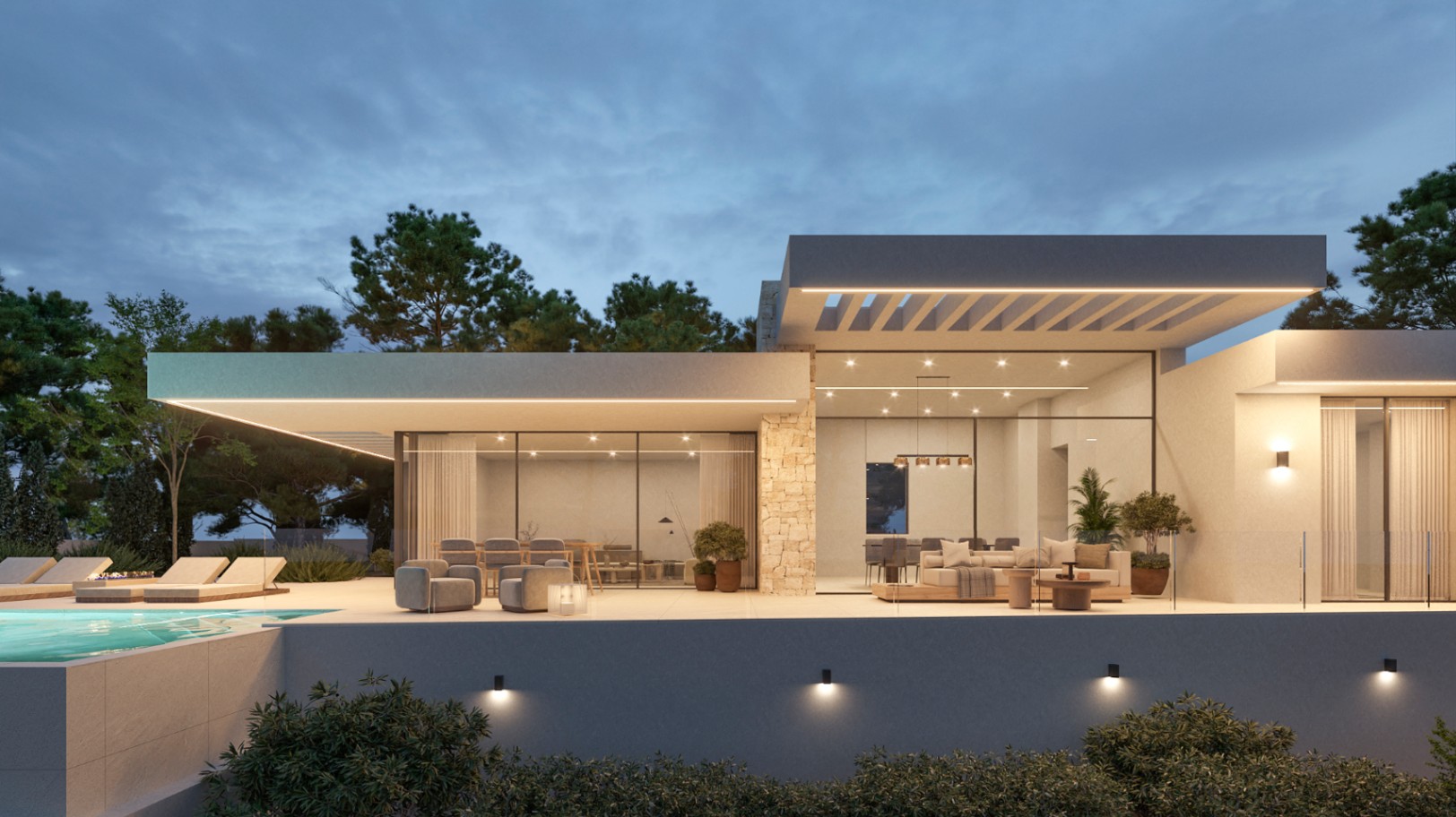 Modern villa facade at dusk featuring floor-to-ceiling glass walls, natural stone accents, and an illuminated terrace overlooking the infinity pool.