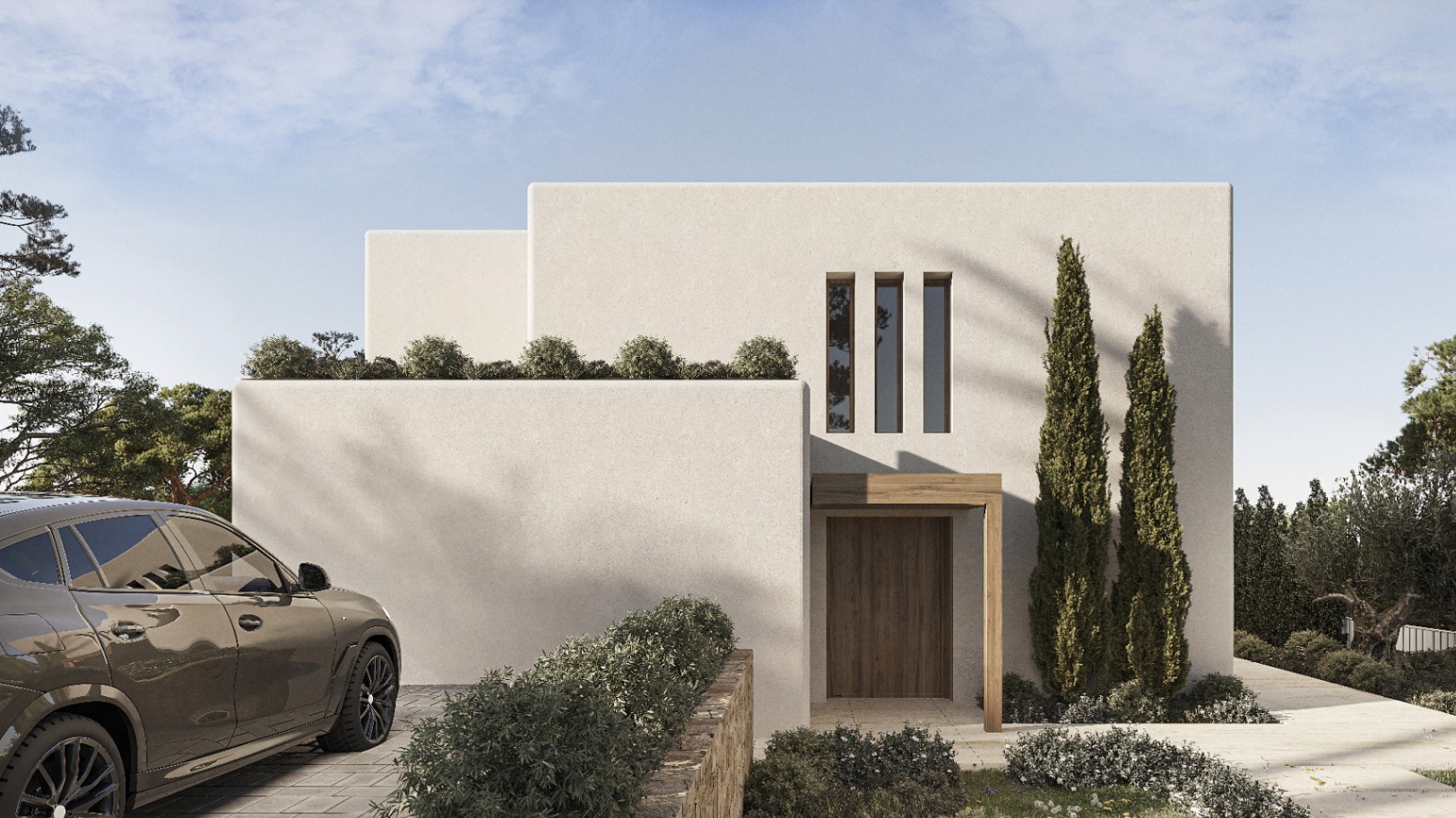 Modern villa facade in Benissa featuring wood door and manicured greenery.