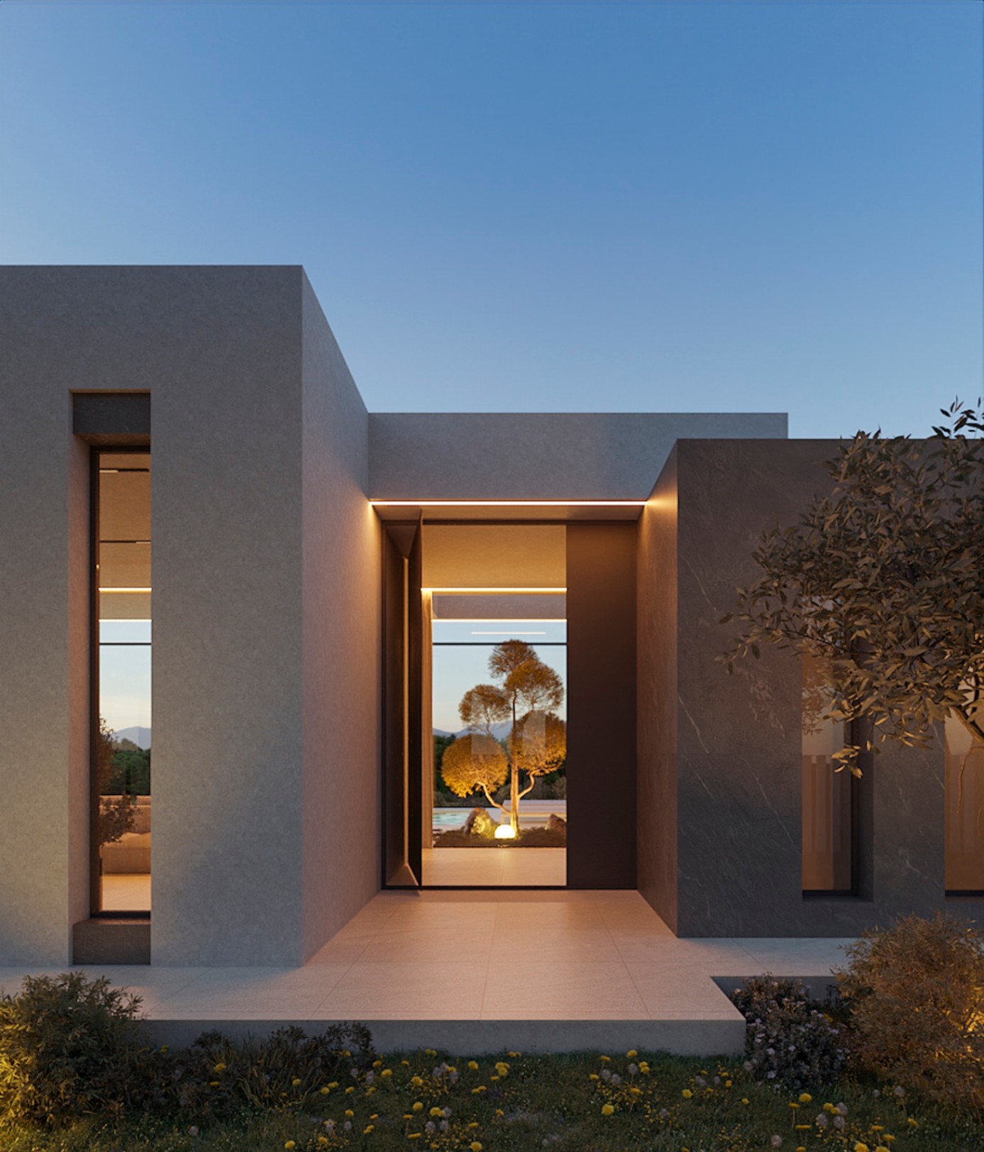 Minimalist main facade featuring a designer entrance with integrated LED lighting and a direct view through to the garden and illuminated tree.