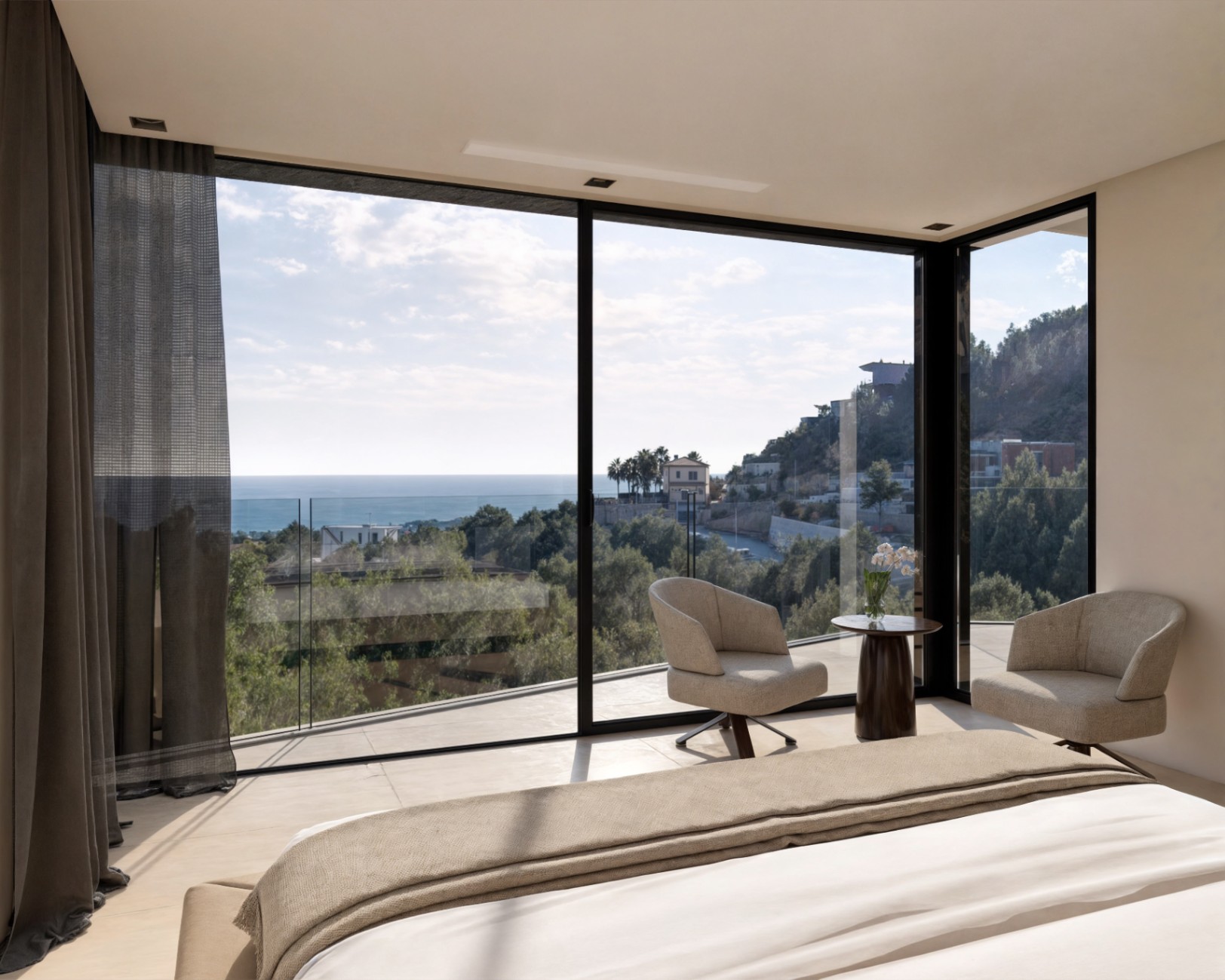 Master bedroom featuring floor-to-ceiling windows, a minimalist seating area, and panoramic views of the Mediterranean Sea and surrounding landscape.