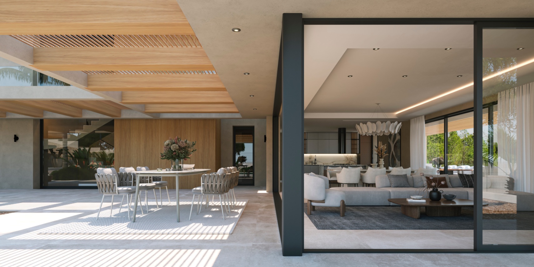 Covered terrace with wooden beams and outdoor dining, seamlessly connected to the open-plan living area and designer kitchen via large glass sliders.