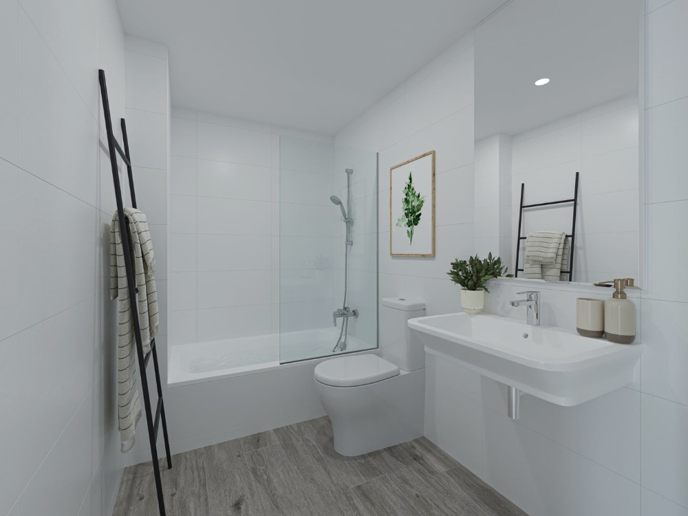 Modern bathroom featuring white wall tiles, wood-effect flooring, a bathtub with a glass partition, and a wall-mounted sink.