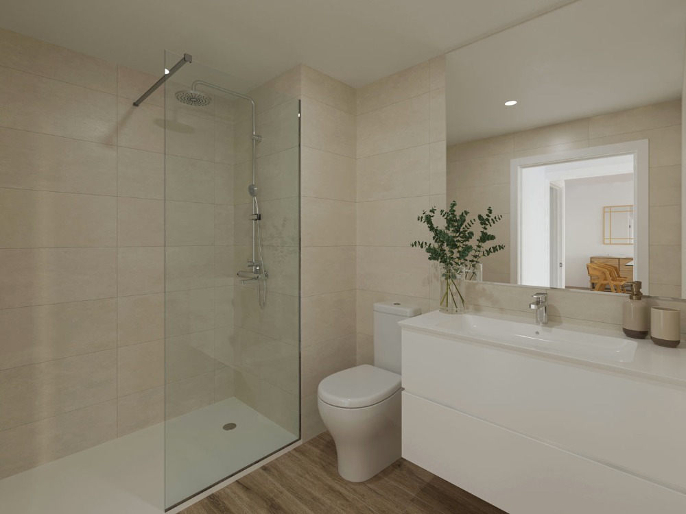 Modern bathroom featuring a walk-in shower with glass screen, sand-toned tiling, and a white floating vanity with integrated sink.