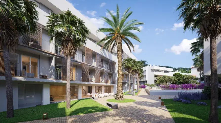 Modern apartment exterior featuring landscaped gardens with palm trees, a paved walkway, and a communal swimming pool set against a contemporary white facade with slatted screens.