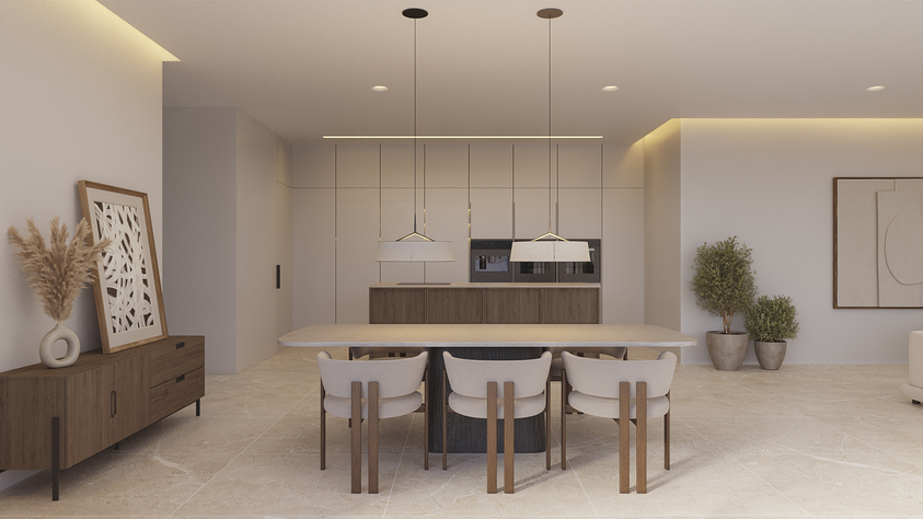 Modern open-plan dining area featuring a stone table, designer chairs, and a minimalist kitchen with integrated appliances and warm indirect lighting.
