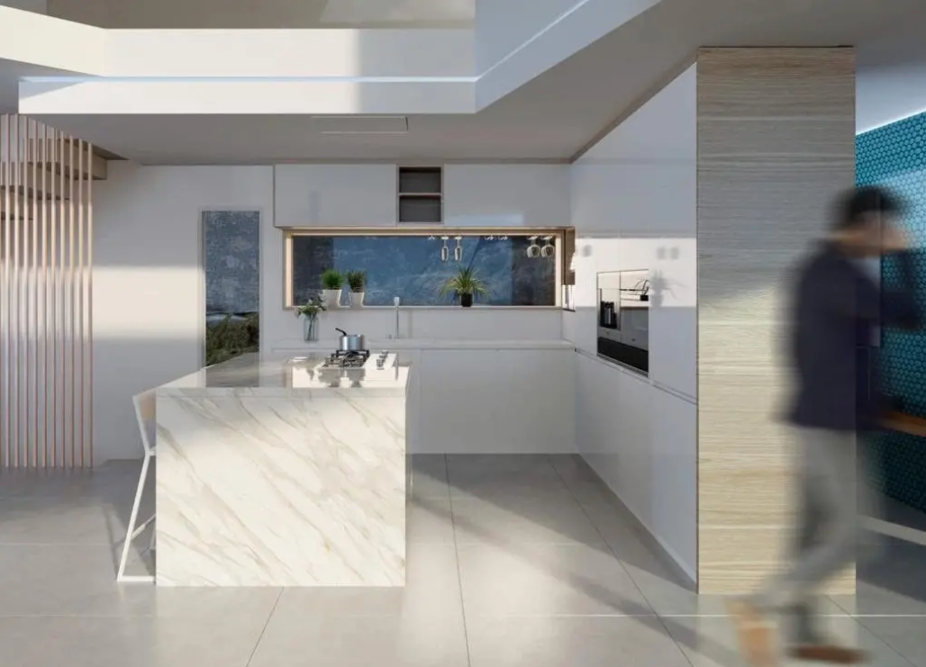 Modern kitchen featuring a marble-veined island with integrated gas cooktop, minimalist white cabinetry, and a horizontal window backsplash providing natural light.
