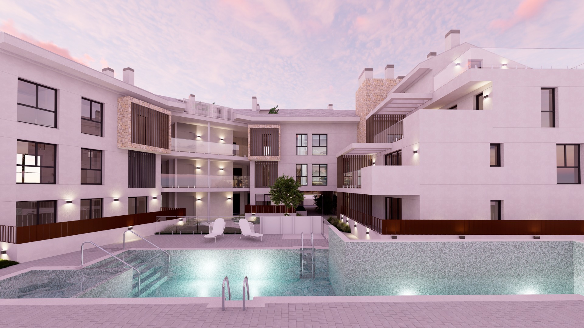 Exterior view of the communal pool area with mosaic tiling, glass railings, and white facades featuring stone accents and wooden slats under a sunset sky.