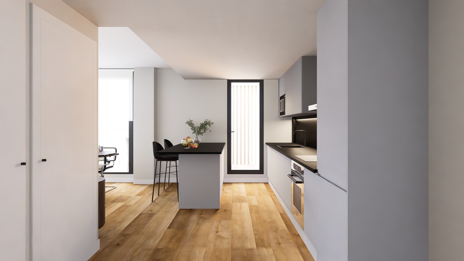 Modern open-plan kitchen featuring grey cabinetry, black countertops, and a central island with seating. Light wood flooring extends throughout the bright, minimalist space.