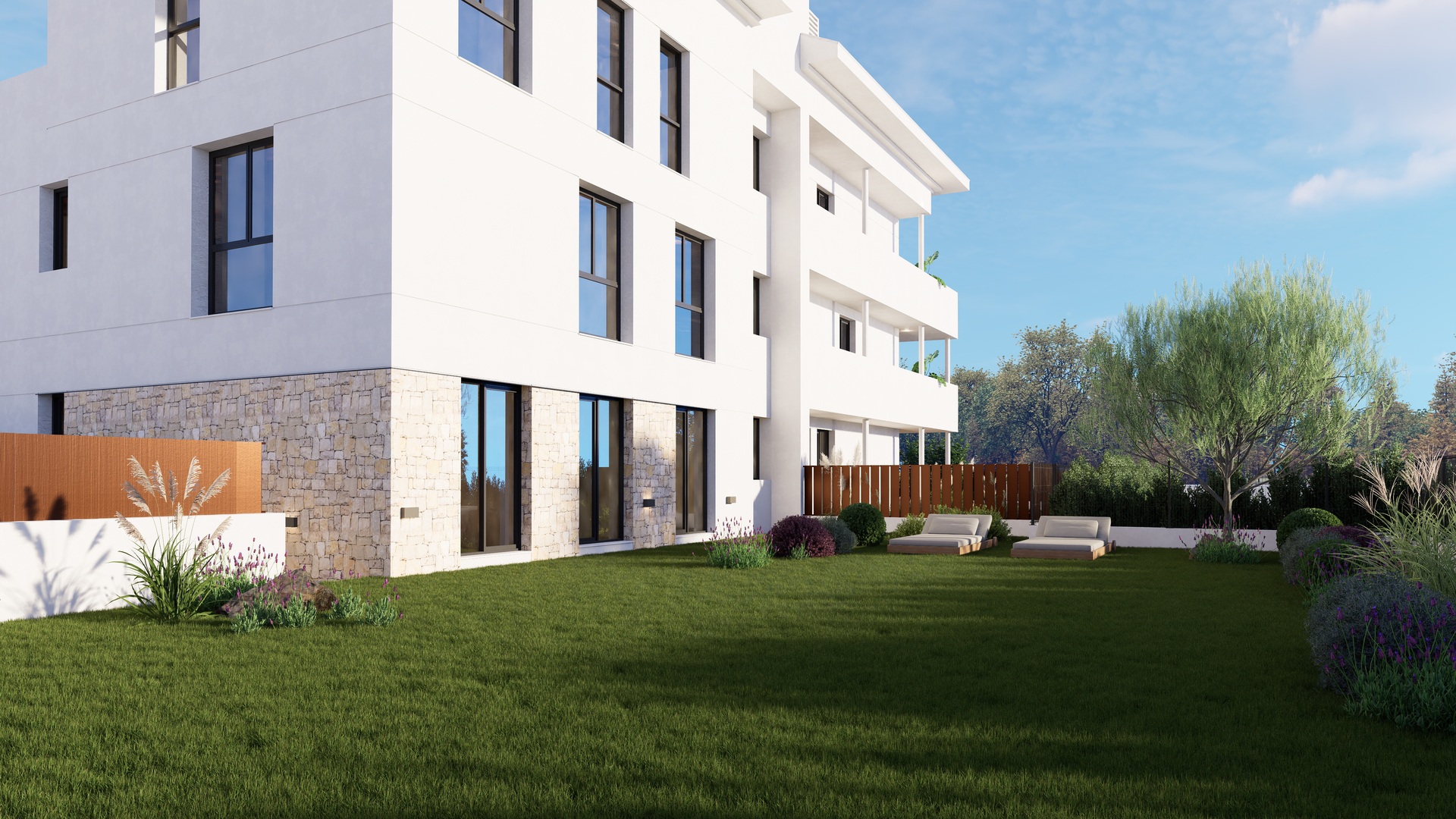Modern white facade with natural stone cladding on the ground floor, featuring a private manicured lawn and landscaped garden with sun loungers.