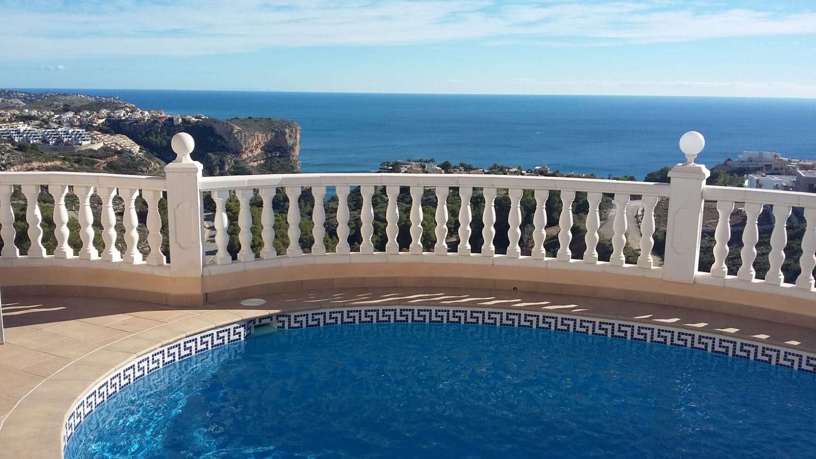 Pool view with white balustrade and sea views in Cumbre del Sol, Benitachell.