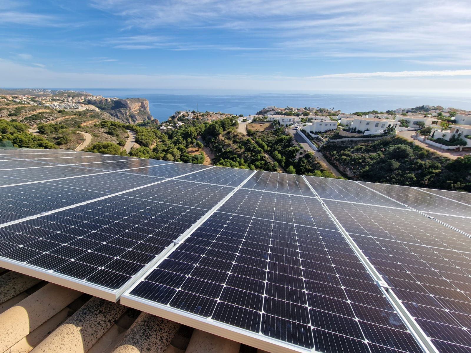 Solar panels with sea views in Cumbre del Sol, Benitachell. Sustainable energy with coastal landscape.